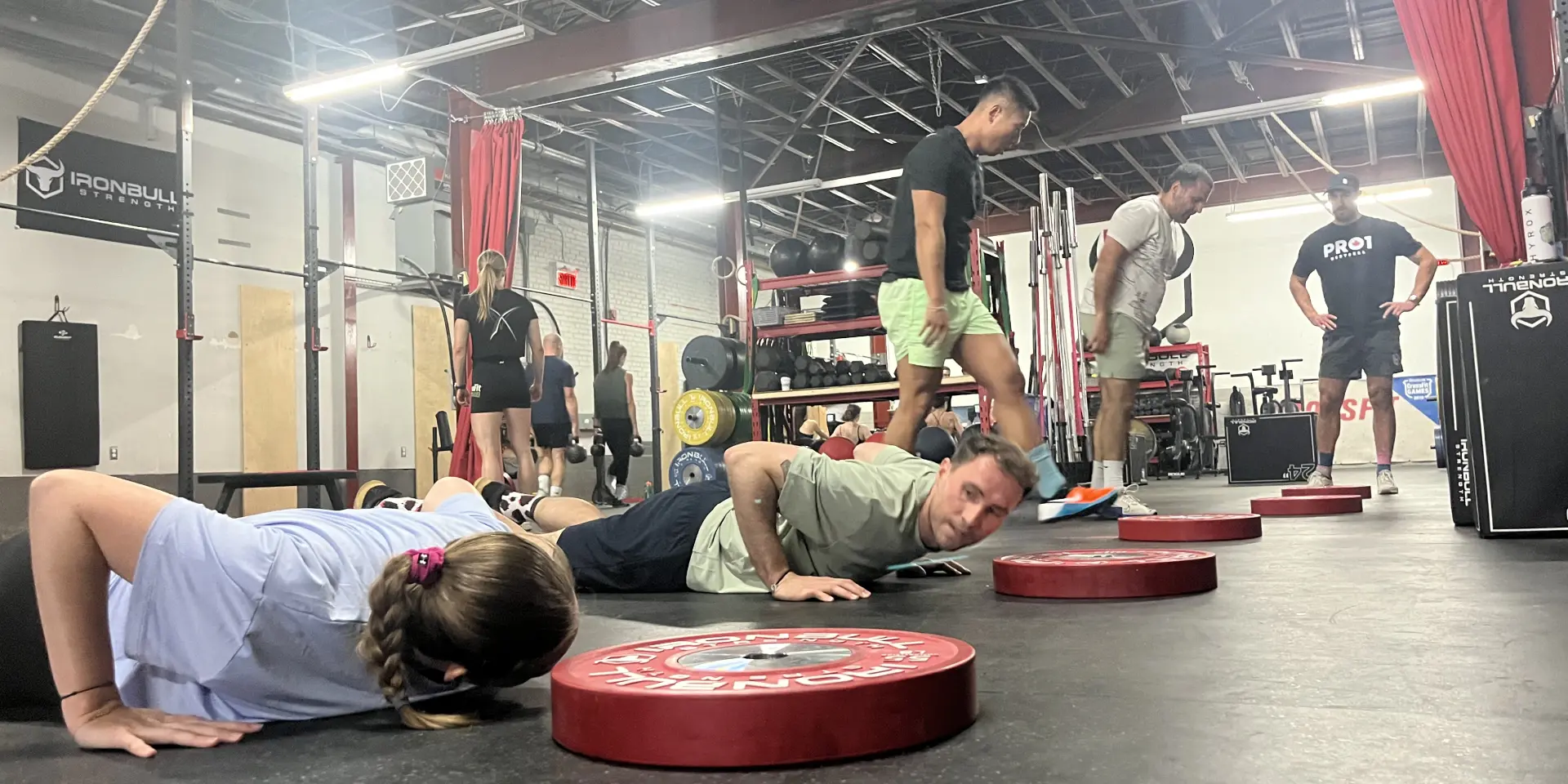coach and woman do push ups