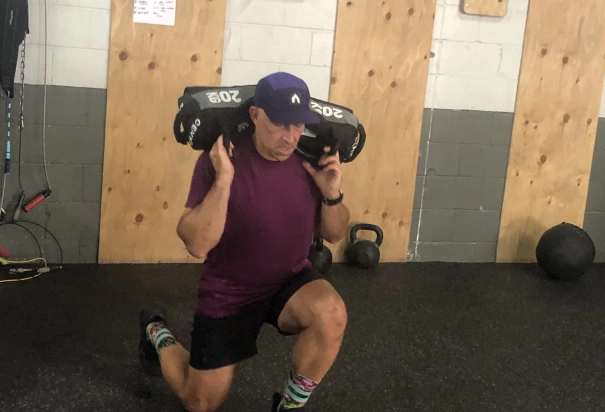 man with 20kg on shoulders