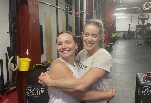 two girls smile